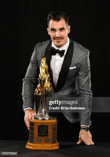 Brian Boyle of the New Jersey Devils poses for a portrait with the Bill Masterton Memorial Trophy at the 2018 NHL Awards at the Hard Rock Hotel &...