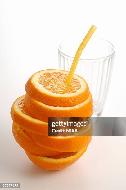 sliced orange with straw - highball glass stock pictures, royalty-free photos & images