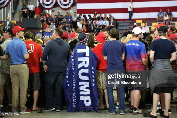 Attendees gather at a rally with U.S. President Donald Trump, not pictured, in Duluth, Minnesota, U.S., on Wednesday, June 20, 2018. Trump reversed...