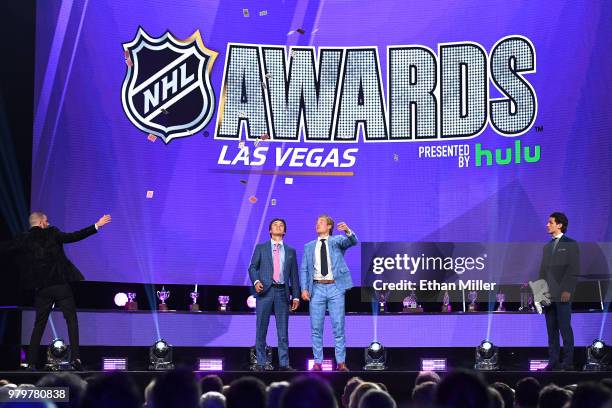 Illusionist Darcy Oake performs a card trick with Clayton Keller of the Arizona Coyotes, Brock Boeser of the Vancouver Canucks and Mathew Barzal of...