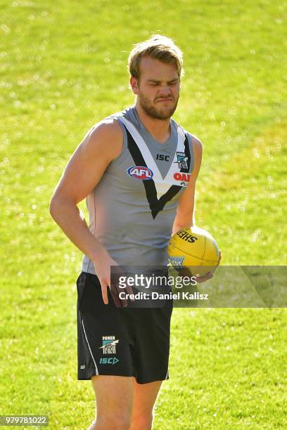 Jack Watts of the Power looks on during a Port Power AFL training session at the Adelaide Oval on June 21, 2018 in Adelaide, Australia.