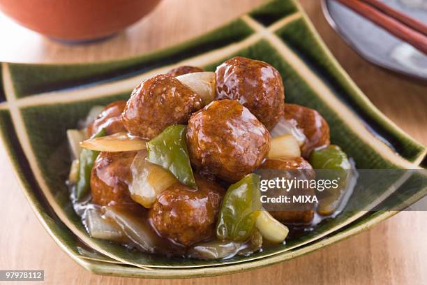 sweet and sour meat ball - sweet and sour dish stock pictures, royalty-free photos & images
