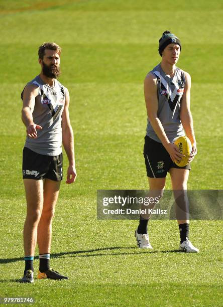 Justin Westhoff of the Power and Todd Marshall of the Power look on during a Port Power AFL training session at the Adelaide Oval on June 21, 2018 in...