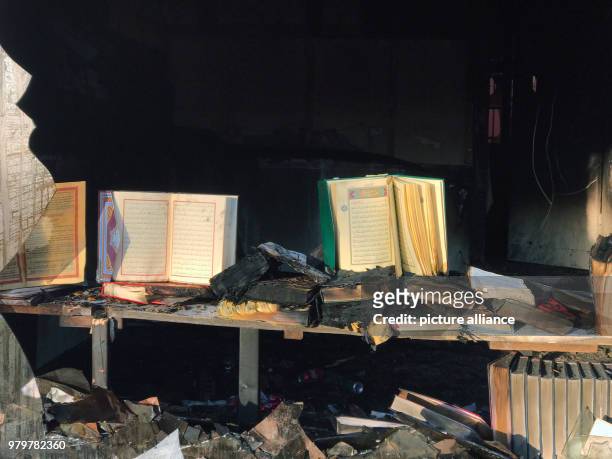 March 2018, Germany, Berlin: Open prayer books in a fire-damaged building on Kuehleweinstrasse, which houses a mosque association. A fire broke out...