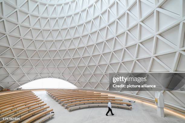 March 2018, Germany, Holzkirchen: Matthias Hefter, representative of the parish council, walks through the interior the new building of the Catholic...