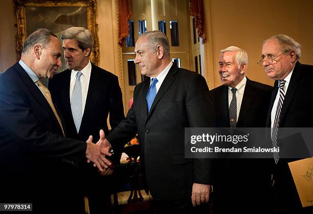 Senator Charles Schumer greets Israeli Prime Minister Benjamin Netanyahu while Senator John Kerry , Senator Richard Lugar and Senator Carl Levin on...