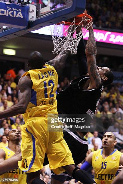 Lawrence Roberts, #4 of Partizan Belgrade competes with Stephane Lasme, #12 of Maccabi Electra Tel Aviv in action during the Euroleague Basketball...