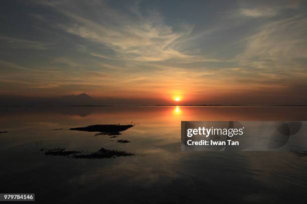 sunset over gili trawangan - gili trawangan stock pictures, royalty-free photos & images