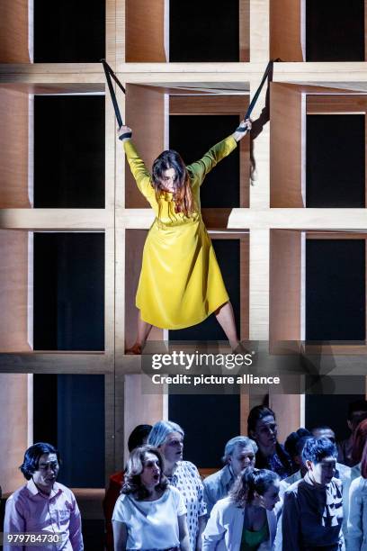 March 2018, Germany, Hamburg: The singer Nadezhda Karyazina performs with choir members during the photo rehearsal of 'Messa da Requiem'. The opera,...