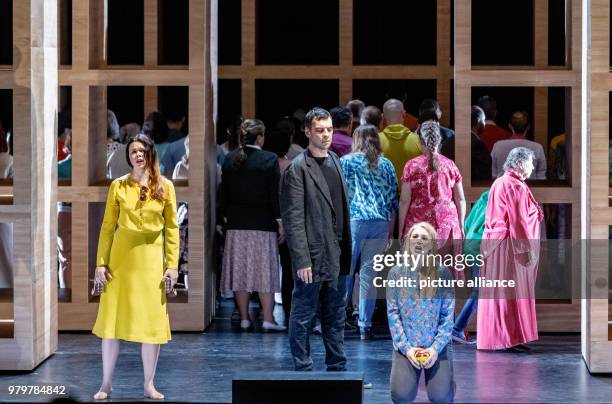 March 2018, Germany, Hamburg: The singer Nadezhda Karyazina , Gabor Bretz and Maria Bengtsson perform with choir members during the photo rehearsal...