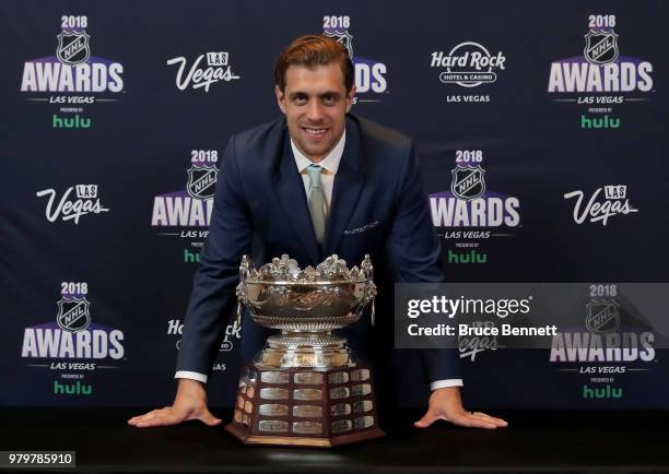 Anze Kopitar of the Los Angeles Kings poses with the Frank J. Selke trophy given to the top defensive forward in the press room at the 2018 NHL...