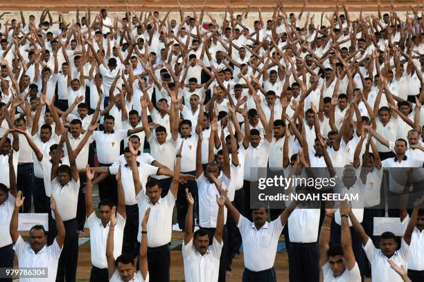 Indian Army personnel take part in a yoga session on International Yoga Day at 1 EME Centre in Secunderabad, the twin City of Hyderabad, on June 21,...