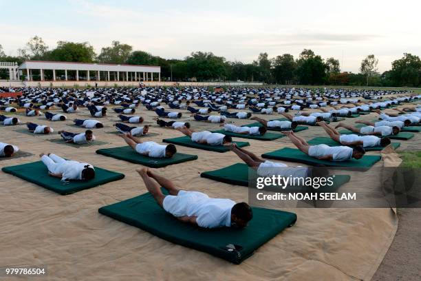 Indian Army personnel take part in a yoga session on International Yoga Day at 1 EME Centre in Secunderabad, the twin City of Hyderabad, on June 21,...