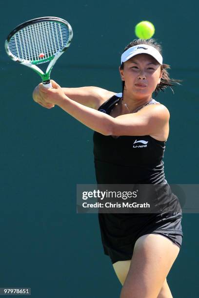 Shuai Peng of China hits a forehand against Vania King during play on day one of the Sony Ericsson Open at Crandon Park Tennis Center on March 23,...