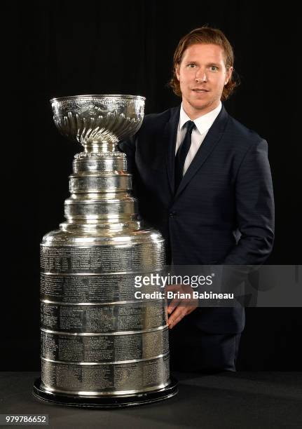 Nicklas Backstrom of the Washington Capitals poses for a portrait with the Stanley Cup trophy at the 2018 NHL Awards at the Hard Rock Hotel & Casino...