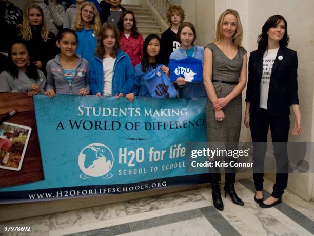 Alexandra Cousteau and Mandy Moore pose for a photo during a photo op in the Russell Senate Office Building the 2010 World Water Day coalition on...
