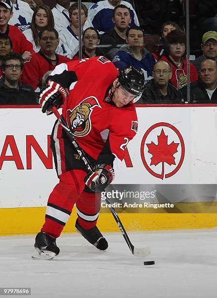 Chris Phillips of the Ottawa Senators shoots the puck against the Toronto Maple Leafs at Scotiabank Place on March 16, 2010 in Ottawa, Ontario,...