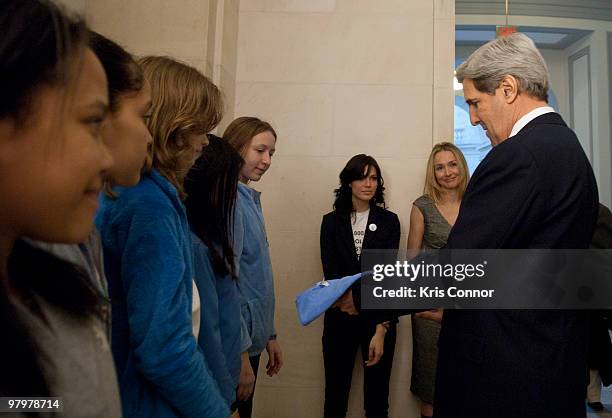 John Kerry speak with students photo during a photo op in the Russell Senate Office Building for the 2010 World Water Day coalition on Capitol Hill...