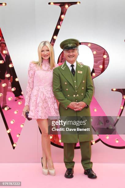 Caprice Bourret poses with the Harrods Green Man at the Summer Party at the V&A in partnership with Harrods at the Victoria and Albert Museum on June...