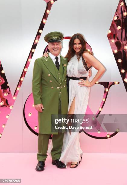 Lisa Snowdon poses with the Harrods Green Man at the Summer Party at the V&A in partnership with Harrods at the Victoria and Albert Museum on June...