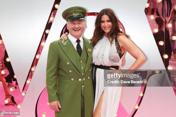 Lisa Snowdon poses with the Harrods Green Man at the Summer Party at the V&A in partnership with Harrods at the Victoria and Albert Museum on June...