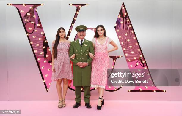 Laurie Mills and Maddie Mills poses with the Harrods Green Man at the Summer Party at the V&A in partnership with Harrods at the Victoria and Albert...