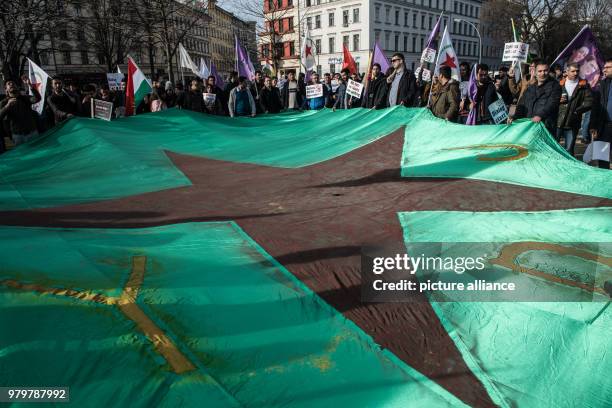 March 2018, Germany, Berlin: Participants of a demonstration against the Turkush military operation in the Syrian town Afrin, which is predominantly...