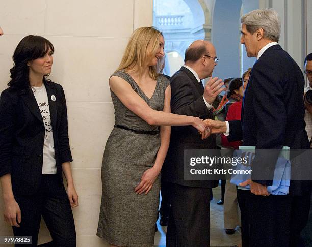 Mandy Moore, Alexandra Cousteau and John Kerry shake hands during a photo op in the Russell Senate Office Building for the 2010 World Water Day...