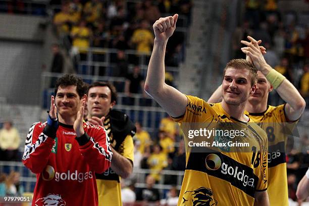 Bjarte Myrhol and Henning Fritz of Rhein-Neckar Loewen of Rhein-Neckar Loewen celebrate with team mates after the Toyota Bundesliga match between...