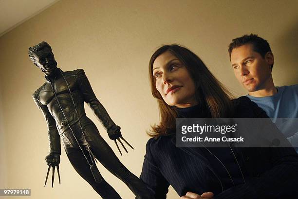 Producer Lauren Shuler Donner and Director Bryan Singer pose for a portrait session for the Los Angeles Times with X-Men character Wolverine on...