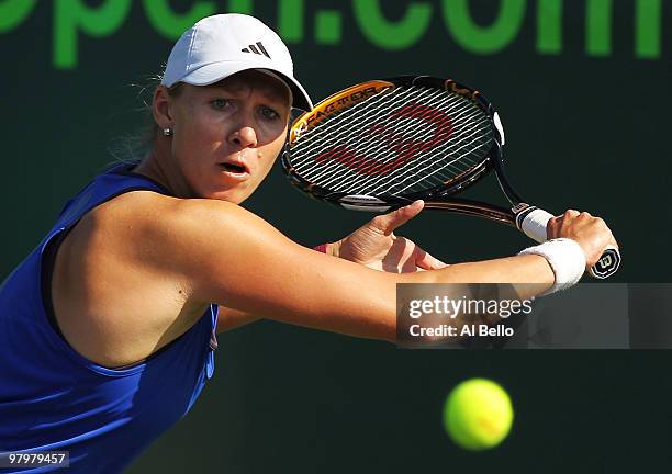 Alicia Monk of Australia returns a shot to Ashley Harkleroad of the United States during day one of the Sony Ericsson Open at Crandon Park Tennis...