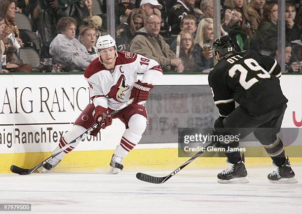 Shane Doan of the Phoenix Coyotes handles the puck against Steve Ott of the Dallas Stars on March 21, 2010 at the American Airlines Center in Dallas,...