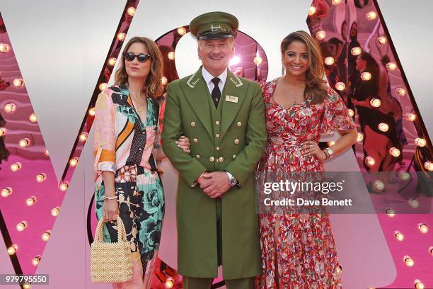 Kelly Eastwood and Katy Wickremesinghe poses with the Harrods Green Man at the Summer Party at the V&A in partnership with Harrods at the Victoria...