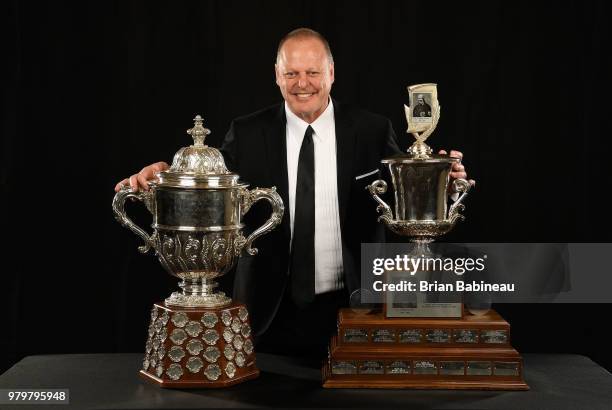 Head Coach Gerard Gallant of the Vegas Golden Knights poses for a portrait with the Clarence S. Campbell Bowl and the Jack Adams Award at the 2018...
