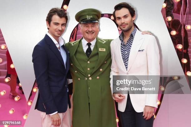 Piotr Krzymowski and Mark-Francis Vandelli pose with the Harrods Green Man at the Summer Party at the V&A in partnership with Harrods at the Victoria...