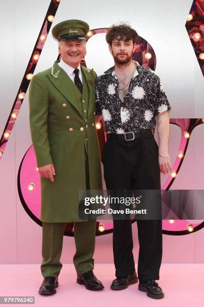 Tom Grennan poses with the Harrods Green Man at the Summer Party at the V&A in partnership with Harrods at the Victoria and Albert Museum on June 20,...