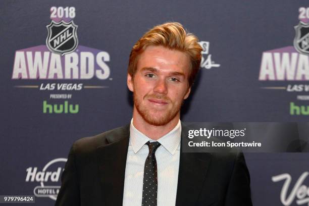 Connor McDavid of the Edmonton Oilers poses for photos on the red carpet during the 2018 NHL Awards presented by Hulu at The Joint, Hard Rock Hotel &...