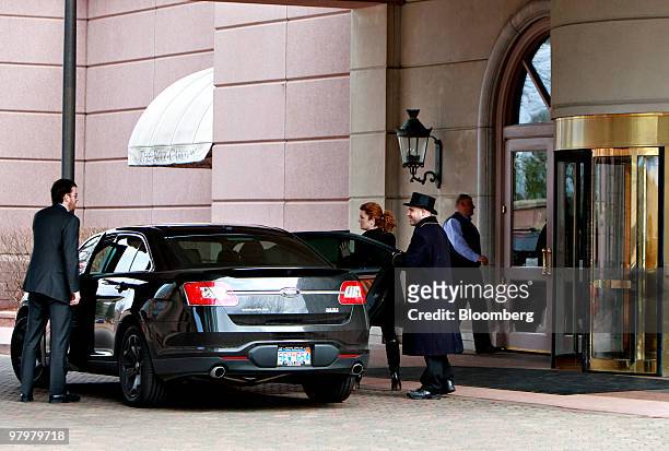 Hotel visitors get into a vehicle outside the Dearborn Ritz-Carlton hotel in Dearborn, Michigan, U.S., on Tuesday, March 23, 2010. In Dearborn, home...