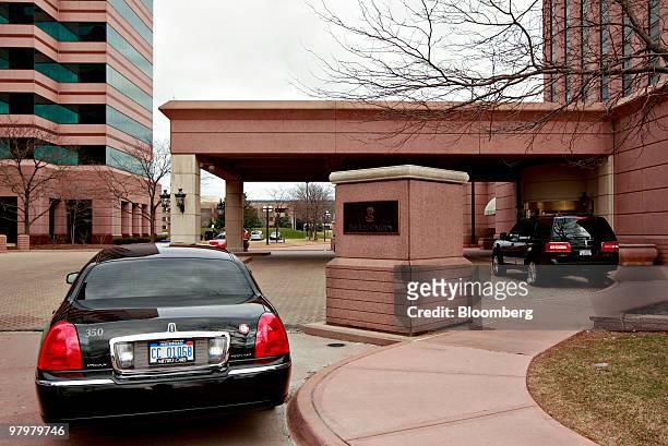 Vehicles sit outside the Dearborn Ritz-Carlton hotel in Dearborn, Michigan, U.S., on Tuesday, March 23, 2010. In Dearborn, home of resurgent Ford...