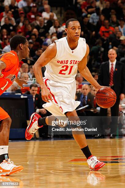 Guard Evan Turner of the Ohio State Buckeyes controls the ball against the Illinois Fighting Illini in the semifinals of the Big Ten Men's Basketball...