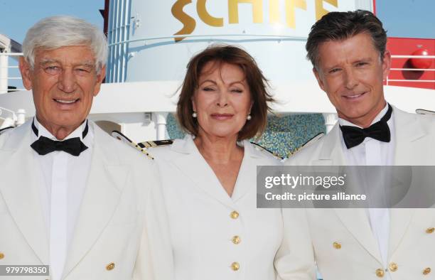 August 2011, Germany, Hamburg: Actor Siegried Rauch , actress Heide Keller and actor Nick Wilder smile onboard the cruiseship 'MS Deutschland' during...