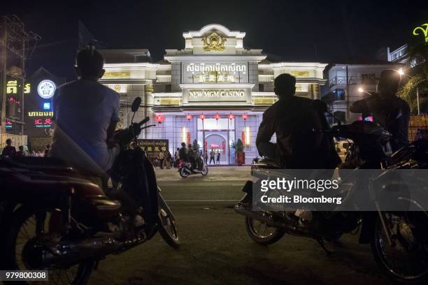 Motorbike taxis wait for customers outside the New Mei Gao Mei casino in Sihanoukville, Cambodia, on Friday, March 30, 2018. It's against the law for...