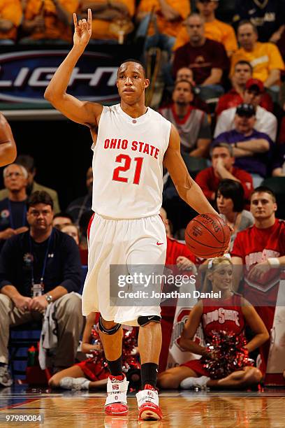 Guard Evan Turner of the Ohio State Buckeyes controls the ball against the Michigan Wolverines during the quarterfinals of the Big Ten Men's...