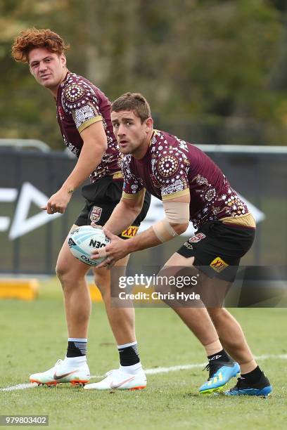 Andrew McCullough passes during a Queensland Maroons State of Origin training session at Sanctuary Cove on June 21, 2018 in Brisbane, Australia.
