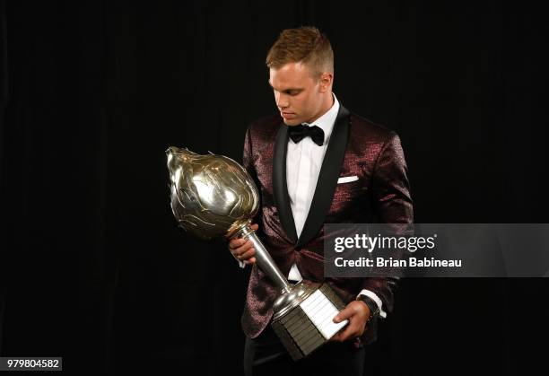 Taylor Hall of the New Jersey Devils poses for a portrait with the Hart Trophy at the 2018 NHL Awards at the Hard Rock Hotel & Casino on June 20,...