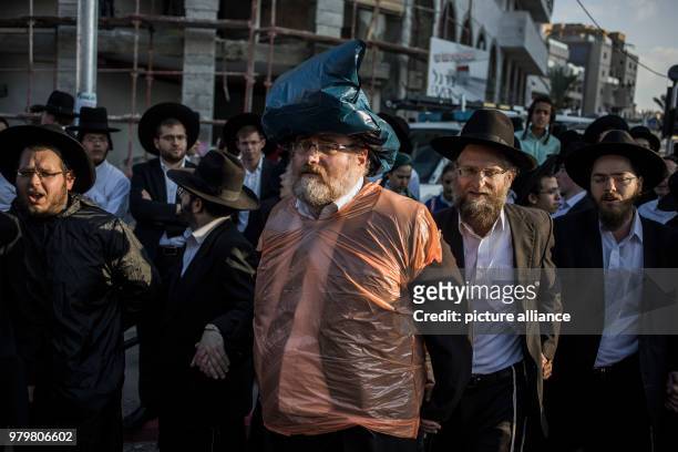 Dpatop - Ultra-Orthodox Jewish men take part in a demonstration against Israeli army conscription in Bnei Brak, Israel, 12 March 2018. Photo: Ilia...