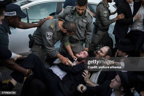 Dpatop - Israeli policemen clash with Ultra-Orthodox Jewish protesters during a demonstration against Israeli army conscription in Bnei Brak, Israel,...