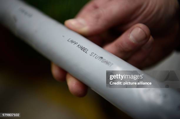 March 2018, Germany, Stuttgart-Vaihingen: A cable of the producer reads 'Lapp Kabel Stuttgart'. Lapp may have profited from the high prices for...