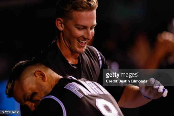 Ryan McMahon of the Colorado Rockies celebrates his three run home run with Gerardo Parra during the fifth inning against the New York Mets at Coors...