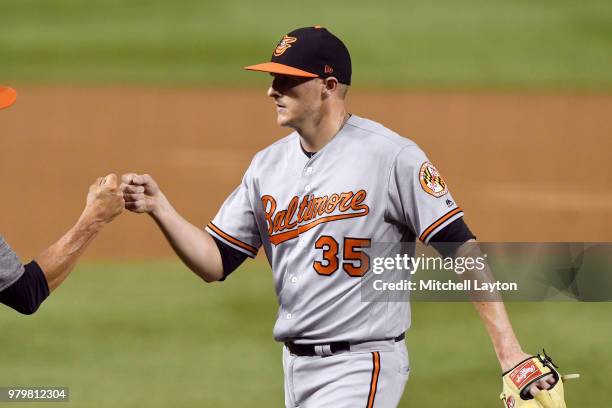 Brad Brach of the Baltimore Orioles celebrates a win after a baseball game against the Washington Nationals at Nationals Park on June 20, 2018 in...